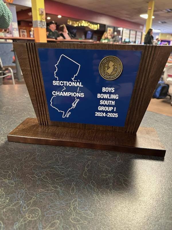 NJ Sectional Champions holding their trophy at Westbrook Lanes